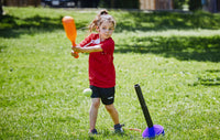 Sports programs, girl playing t-ball