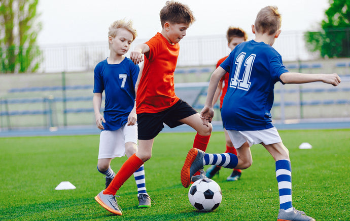 Boys playing football   