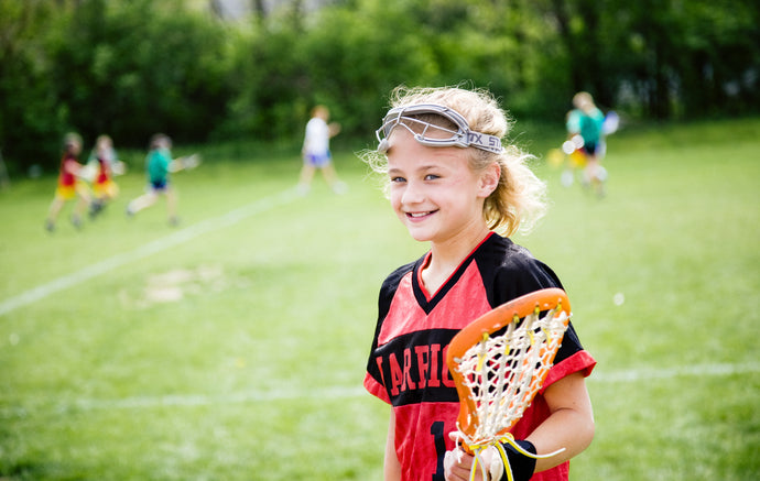 Girl playing Lacrosse